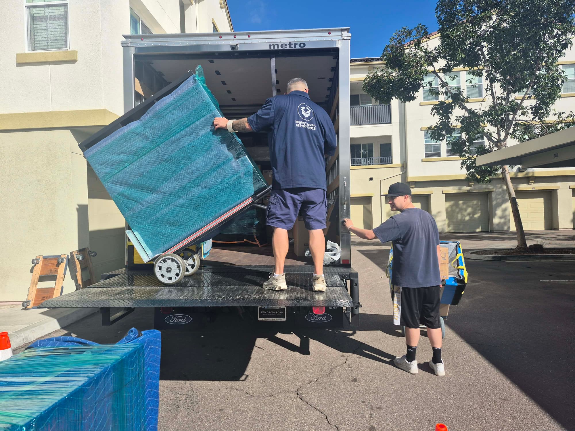 Professional San Diego movers loading furniture with care into moving truck